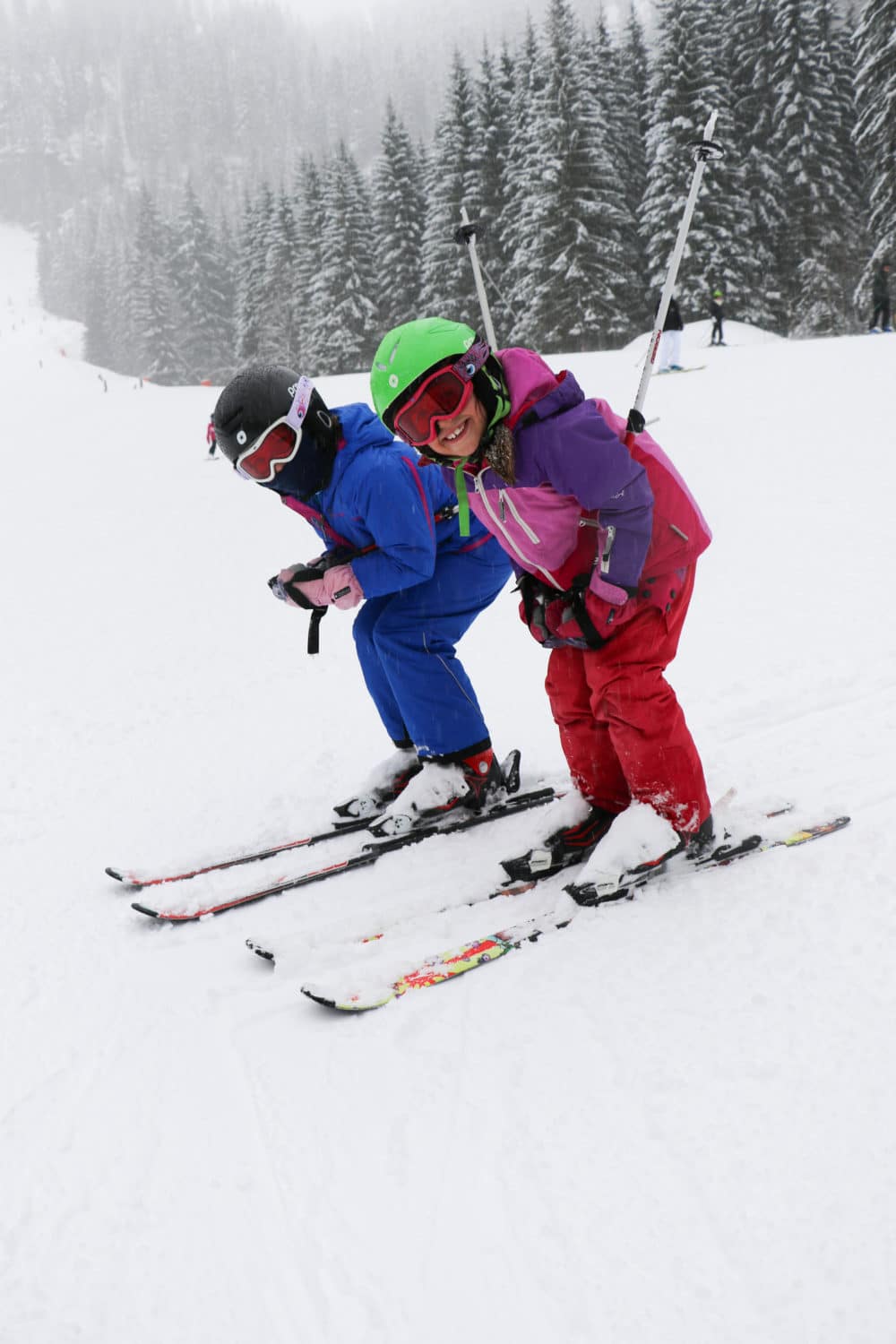 Children posing in ski race position