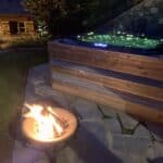 hot tub at night at la grange au merle by clarian chalets